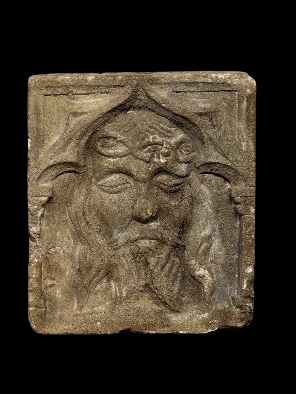 Gothic bas-relief sculpture in sandstone depicting the face of Christ