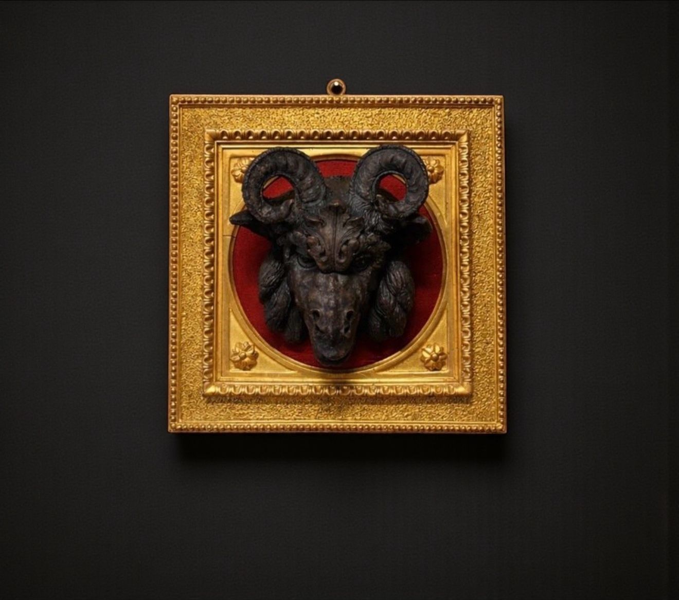 Neo-Renaissance heraldic wall trophy in patinated terracotta, gilded frame, and red velvet, Italy 19th century