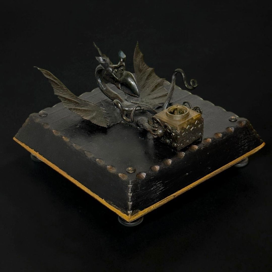 Rare wrought-iron inkwell featuring a winged fantastic creature and a print by Giovanni Volpato. Rare wrought-iron inkwell featuring a winged fantastic creature and a print by Giovanni Volpato.