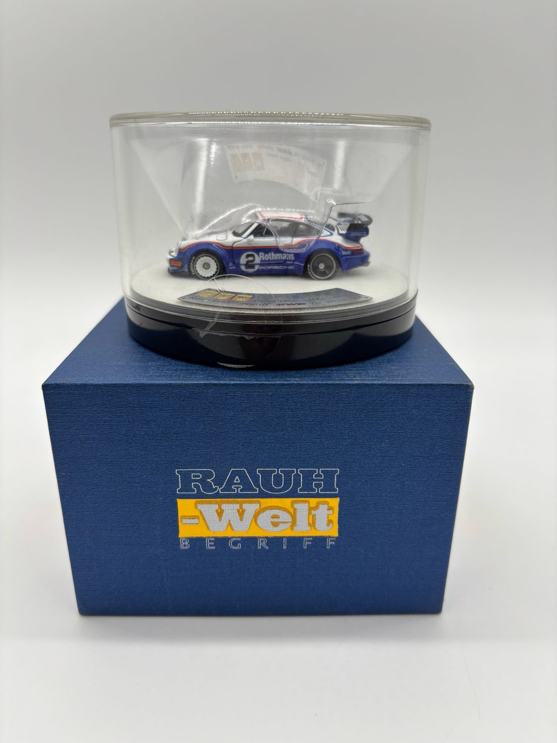[PREORDER] PGM 1/64 Porsche 964 RWB Rauh Welt Begriff Rothmans White/Blue