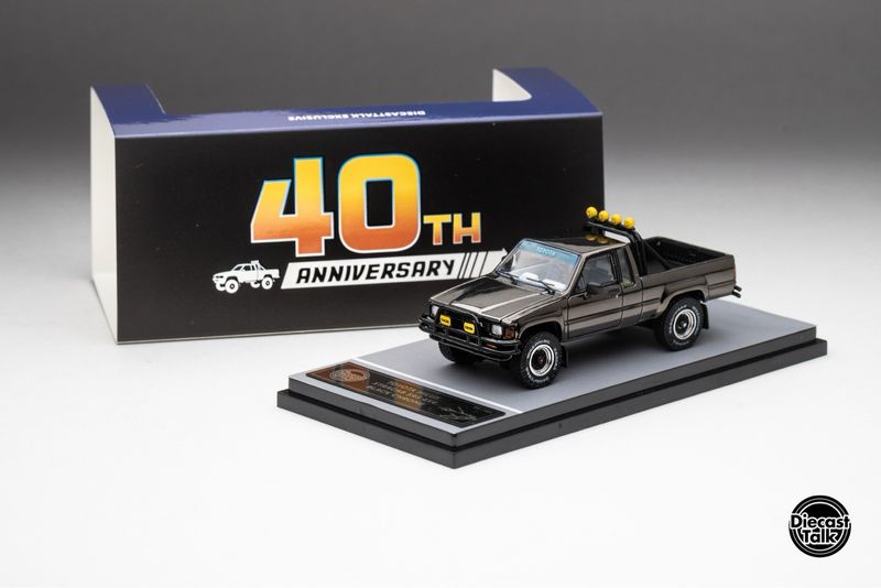 DiecastTalk Toyota 1985 Hilux Xtracab SR5 4x4 Black Chrome with Marty McFly Hoverboard &amp; Figurine | 2025 Malaysia Diecast Expo MDX