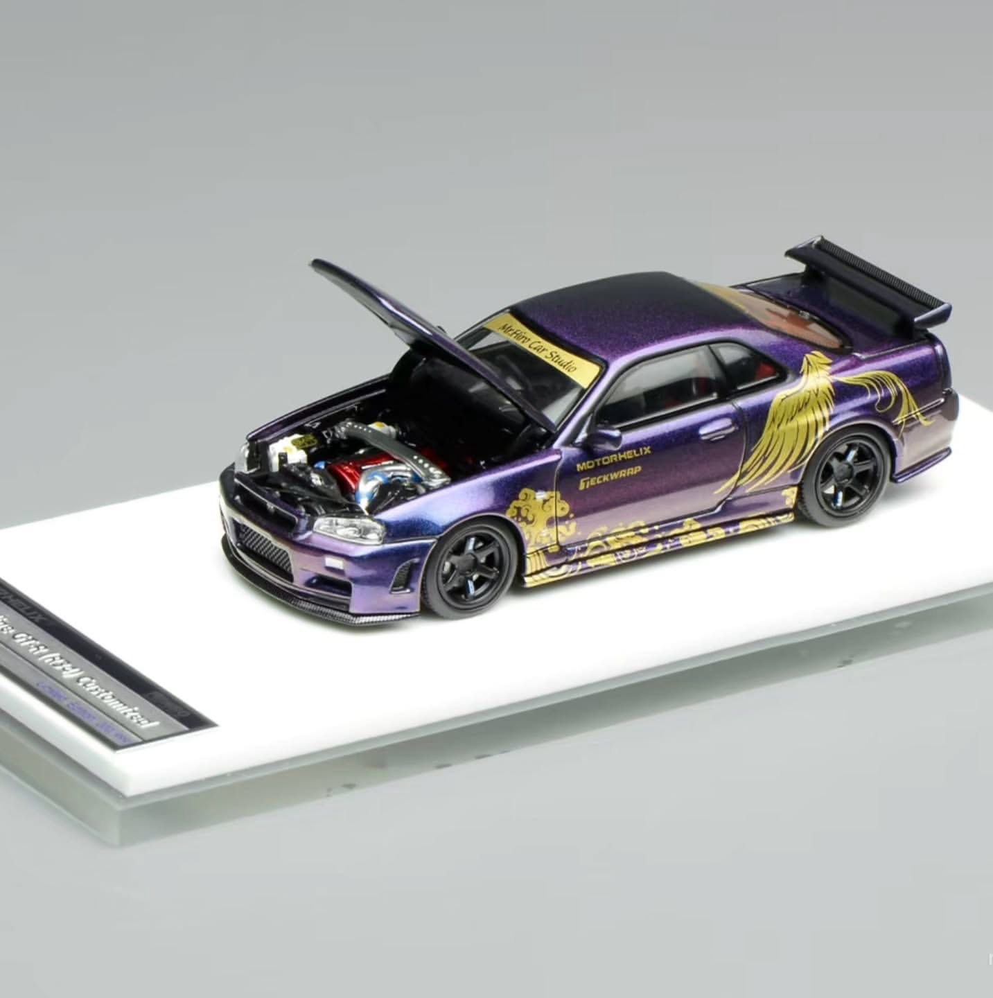 Nissan Skyline GT-R R34TAS 2026 限定版ミニカー Motorhelix Nissan Skyline GT-R (R34) Customized TAS 2026 Purple