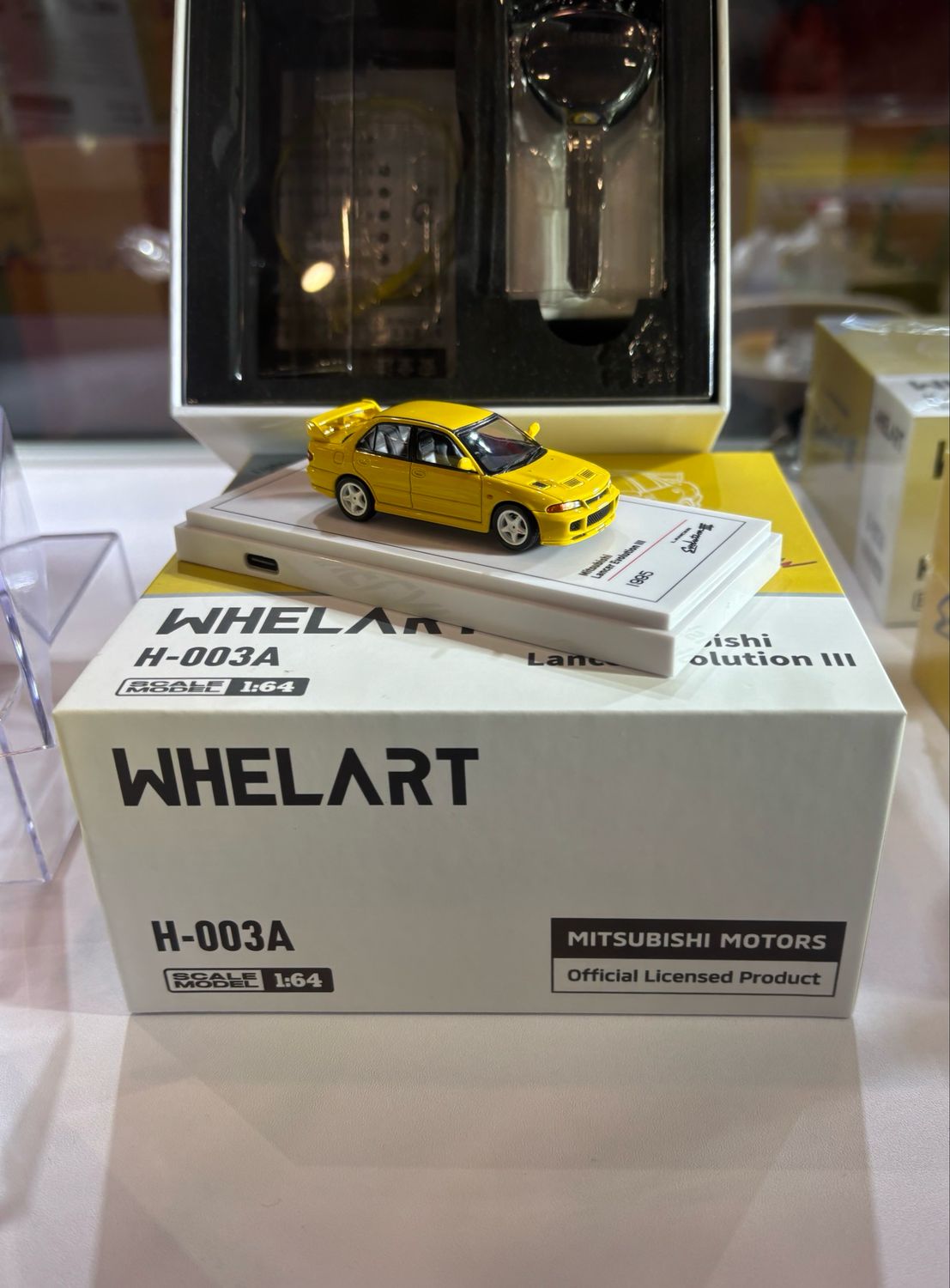 WHELART 1/64 Mitsubishi Lancer Evolution III Yellow / Light Up Enabled WHELART 1/64 Mitsubishi Lancer Evolution III Yellow / Light Up Enabled