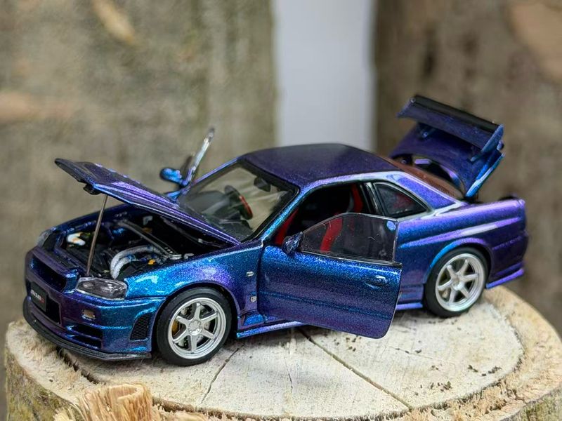 [PREORDER] PGM 1/64 Nissan Skyline GT-R R34 Chameleon | 2026 Hobby Expo China (HEC)