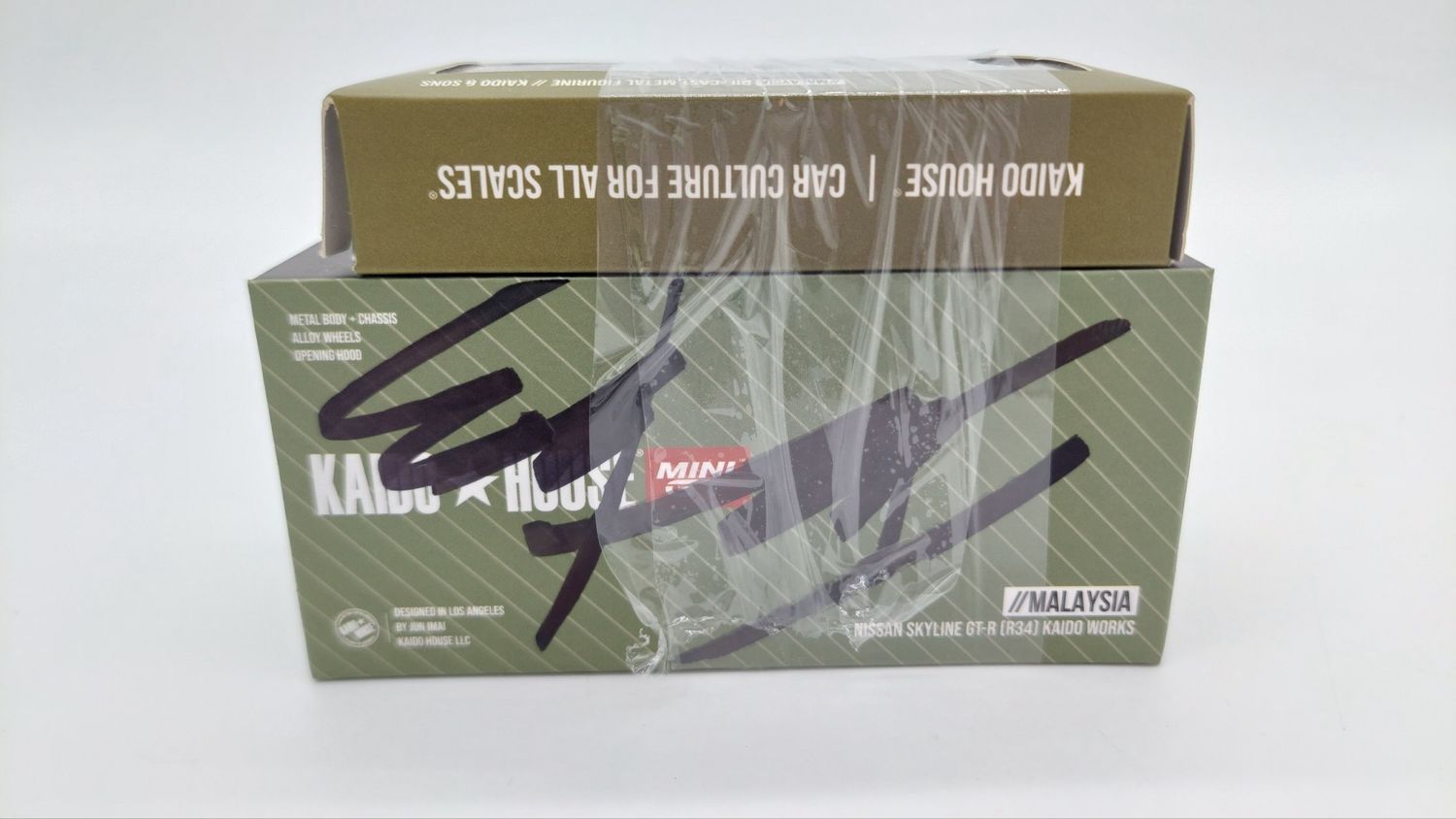 [UNSEALED] KAIDOHOUSE Nissan Skyline GT-R (R34) Kaido Works Millennium Jade (KHMG058) with Exclusive Figurine | 2023 Malaysia Diecast Expo