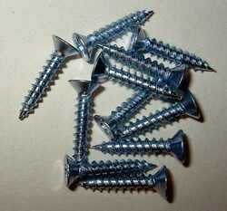 Carriage, cap retaining screw