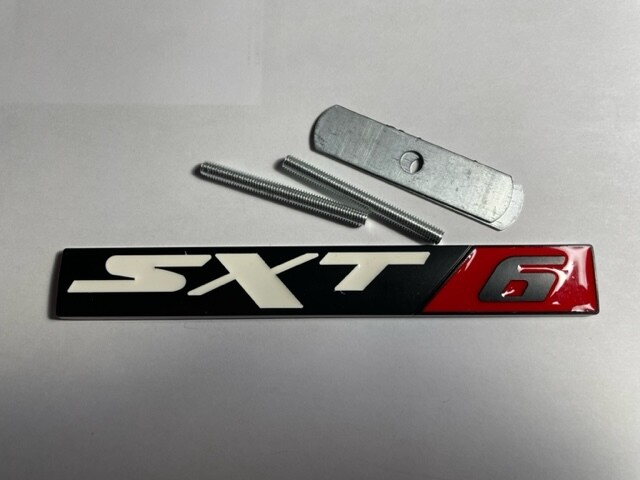 SXT6 metal badge