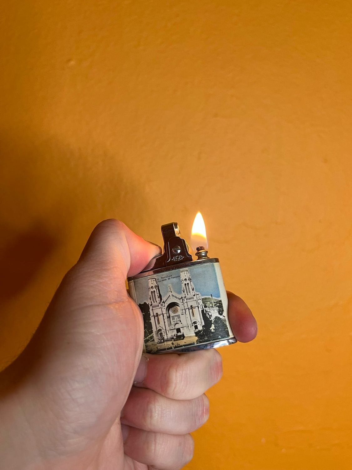 Omega Brand French Canadian Architecture Souvenir Lighter