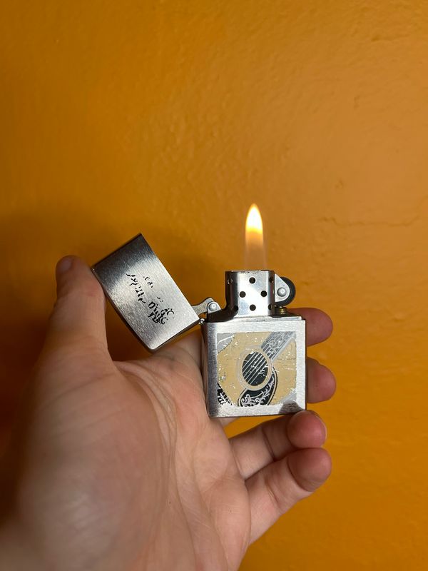 2010 Distressed Guitar Company Advertisement Zippo Lighter