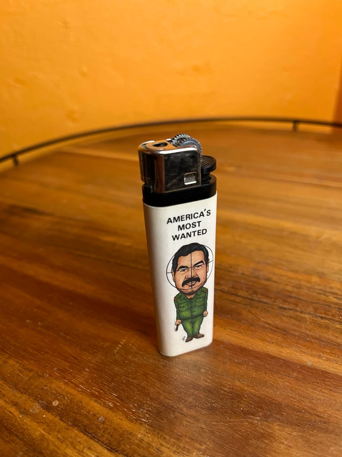 EMPTY UNREFILLABLE America’s Most Wanted Saddam Hussein Disposable Lighter