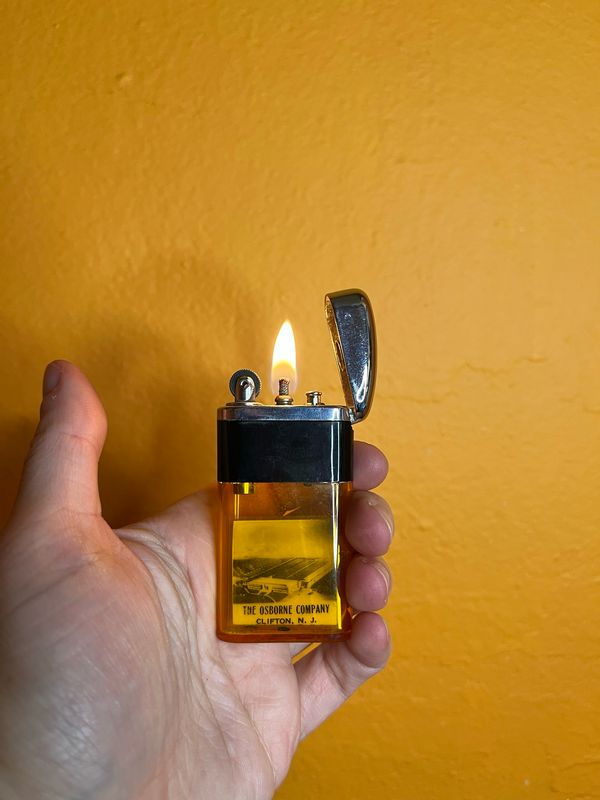 Ritepoint The Osborne Company Clifton NJ Photo Lighter Sample Clear Orange Tank Lighter With Tin