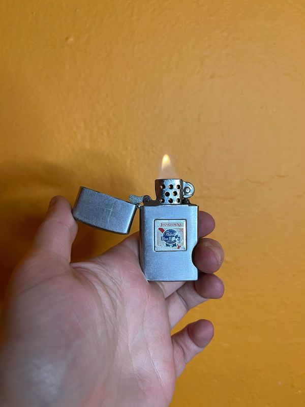Worn Pabst Blue Ribbon PBR Crown Brand Flip Top Lighter