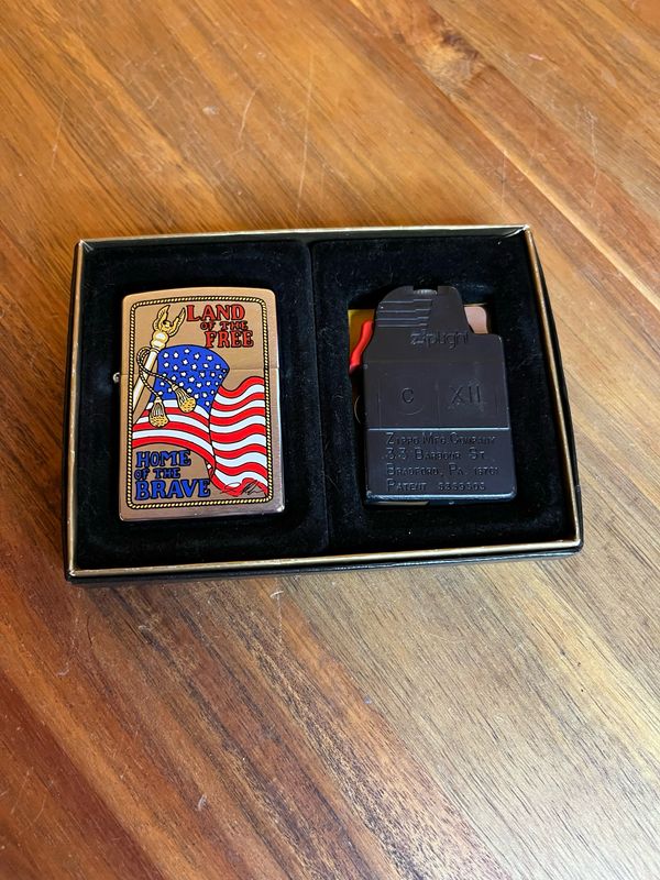 1996 Land Of The Free Home Of The Brave Clicklite Zippo Lighter