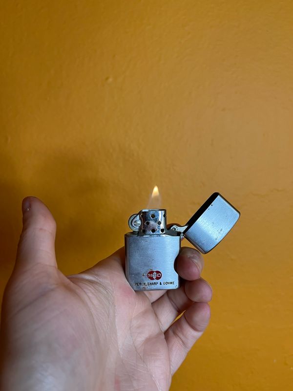 Merck Sharp &amp; Dohme Flip Top Lighter