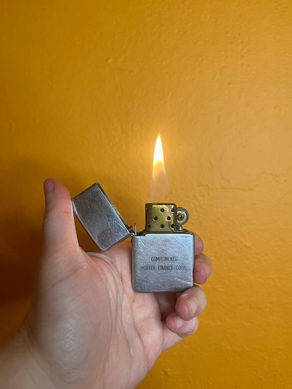 Compliments Porter Finance Corp Burned Holes Park Brand Flip Top Lighter