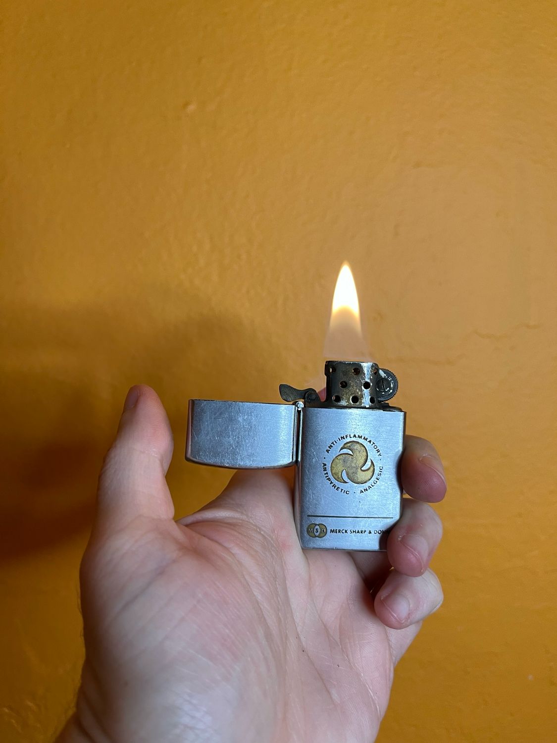 Merck Sharp &amp; Dohme Pharmaceuticals Slim Flip Top Lighter