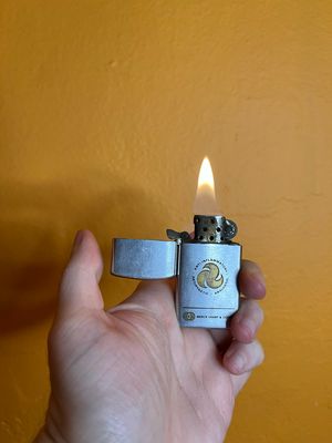 Merck Sharp &amp; Dohme Pharmaceuticals Slim Flip Top Lighter