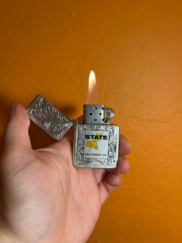 State Equipment Co Silver Filigree Flip Top Lighter