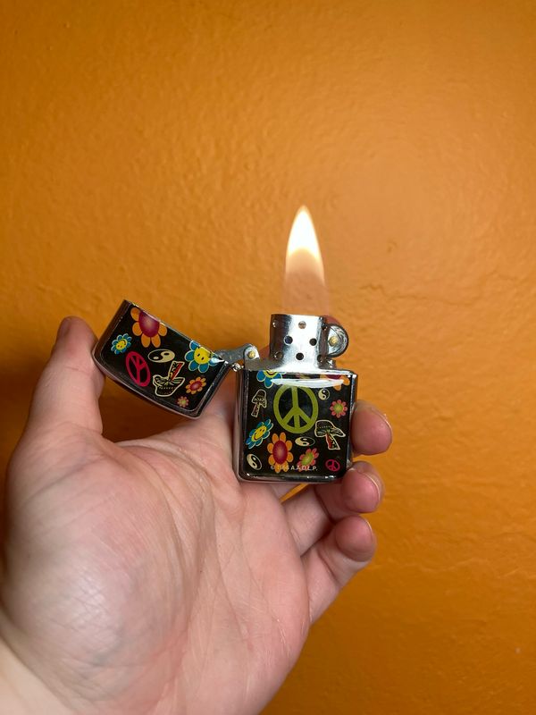 1990s AADLP Hippie Flip Top Lighter