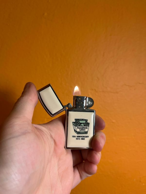 1982 Pennsylvania Lottery 10 Year Anniversary Double Sided Zippo Slim Lighter