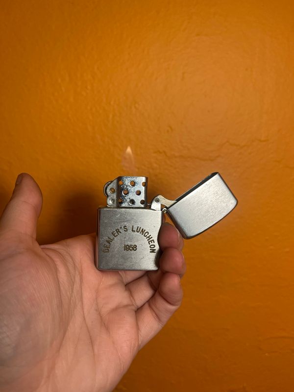 1956 Outboard Marine Dealer’s Luncheon Flip Top Lighter