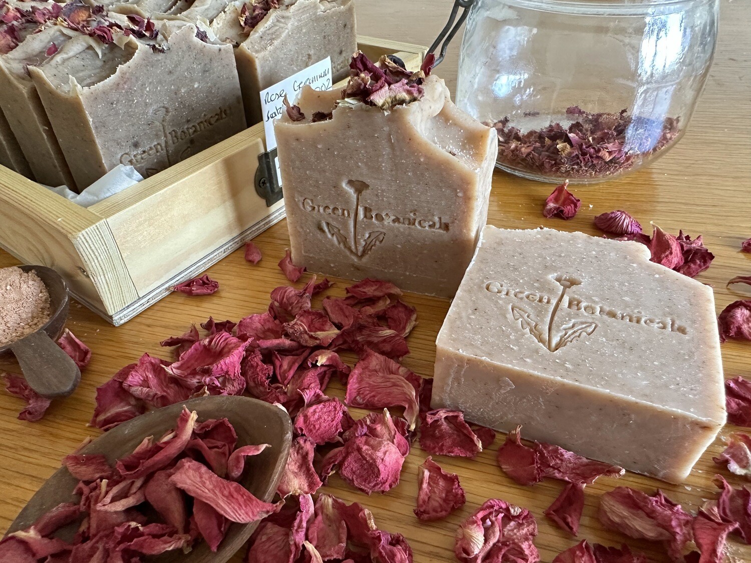 Natural handmade soap bar with pink clay patchouli rose geranium and palmarosa essential oils with rose petals
