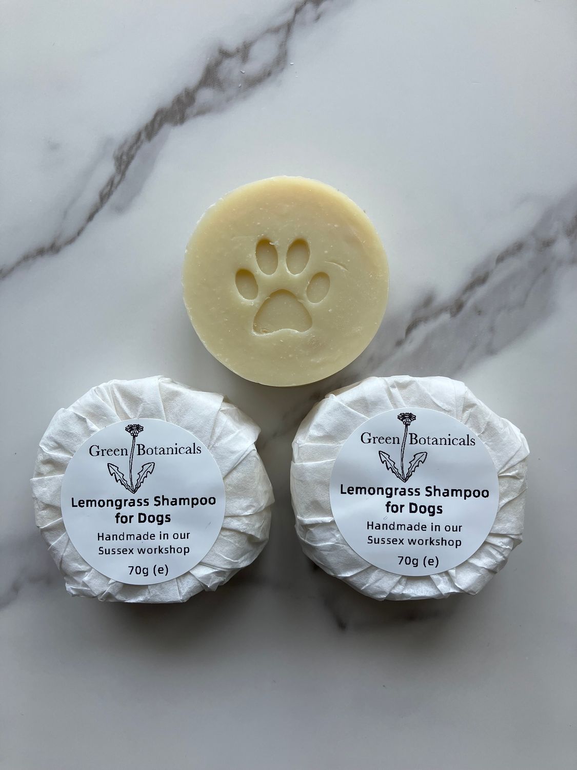 Round natural lemongrass shampoo for dogs with paw stamp