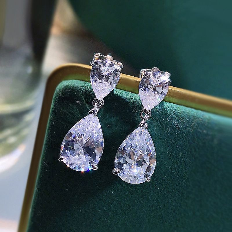 WATER DROP SIMULATED PLATINUM EARRINGS. WATER DROP SIMULATED PLATINUM EARRINGS.