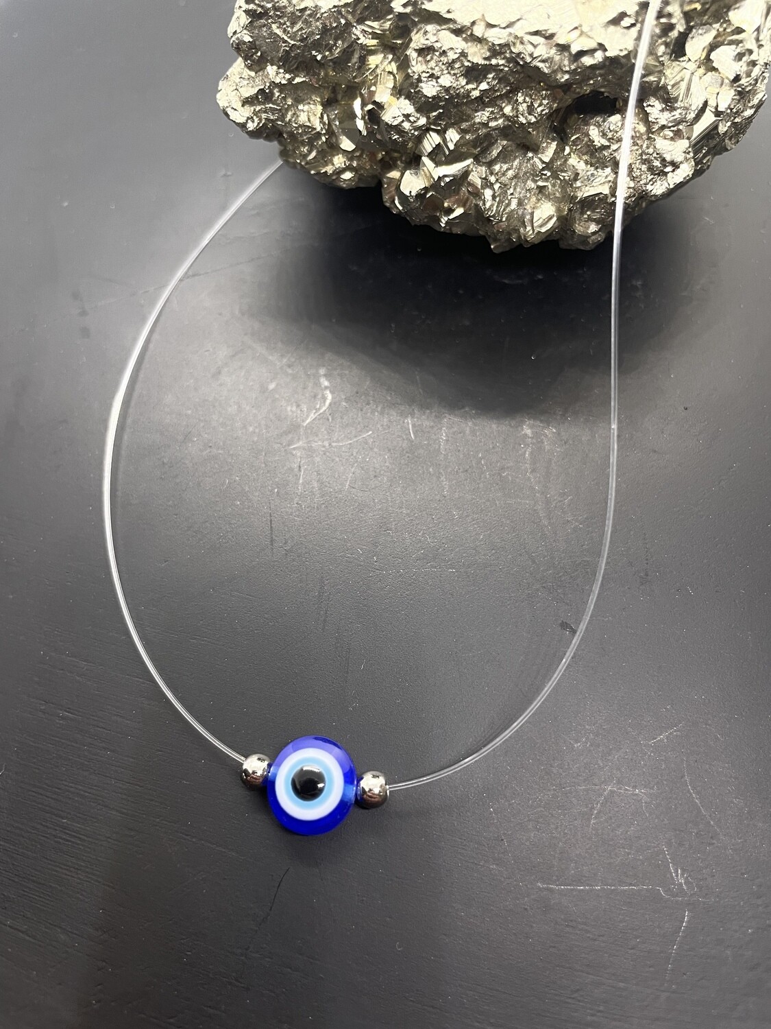 COLLIER TRANSPARENT AVEC PENDENTIF OEIL BLEUE