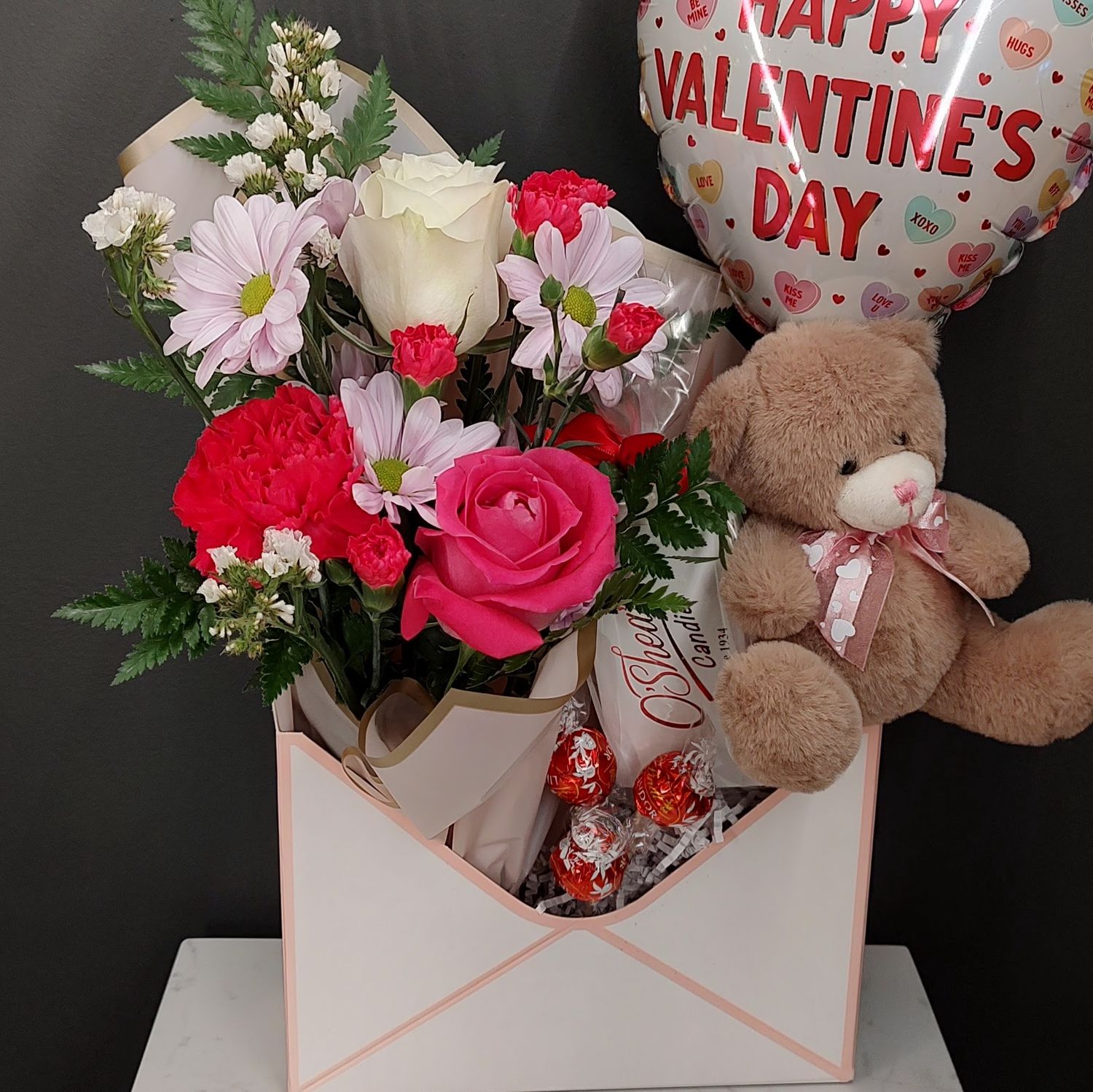 Envelope gift box with fresh flowers pink