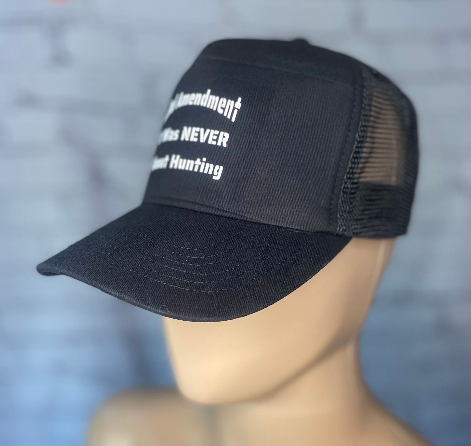 It Was Never About Hunting Truckers Hat