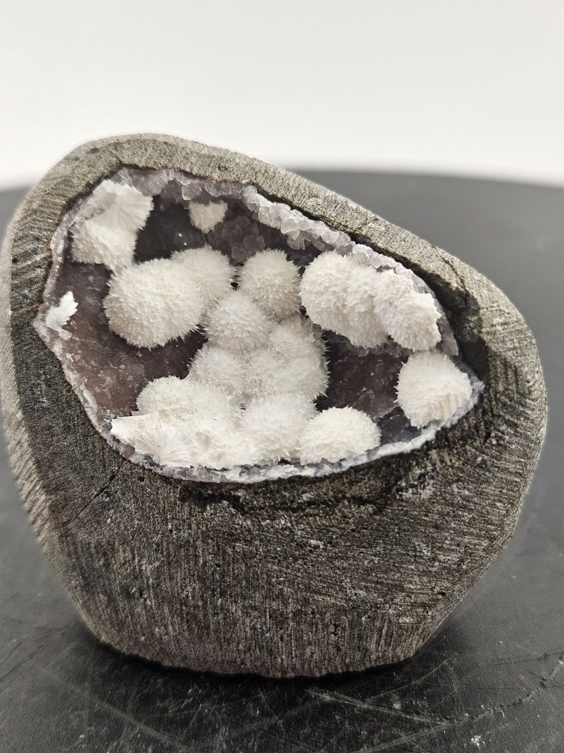 Okenite balls w/red Chalcedony geode.  From India