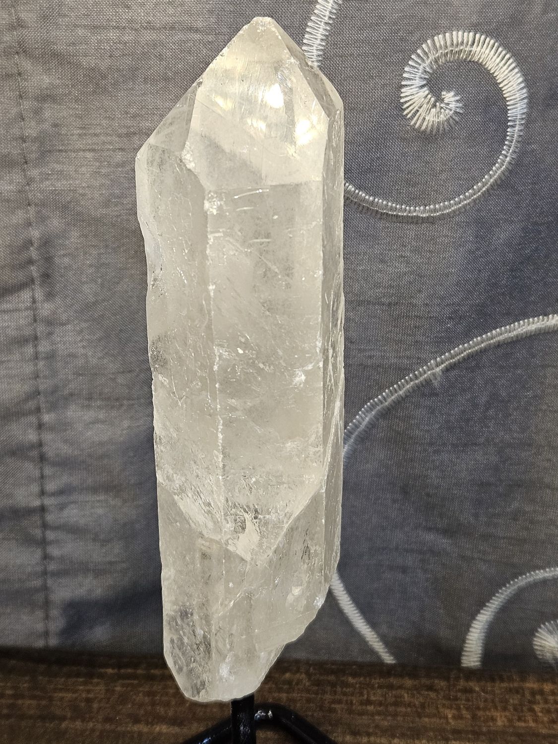 Quartz point on metal stand.