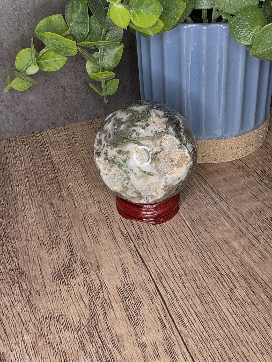 Moss Agate sphere w/wooden stand