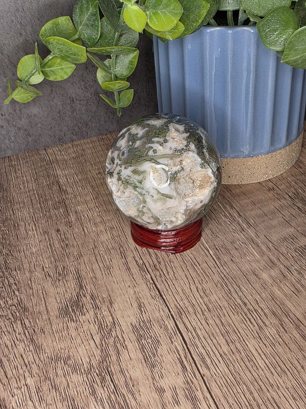 Moss Agate sphere w/wooden stand