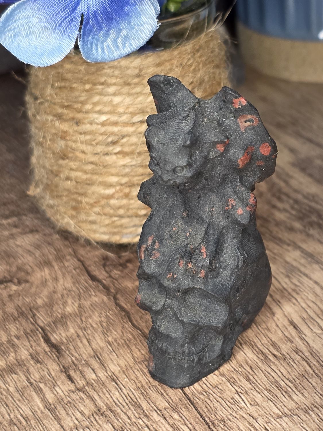 Gargoyle on skull carving.