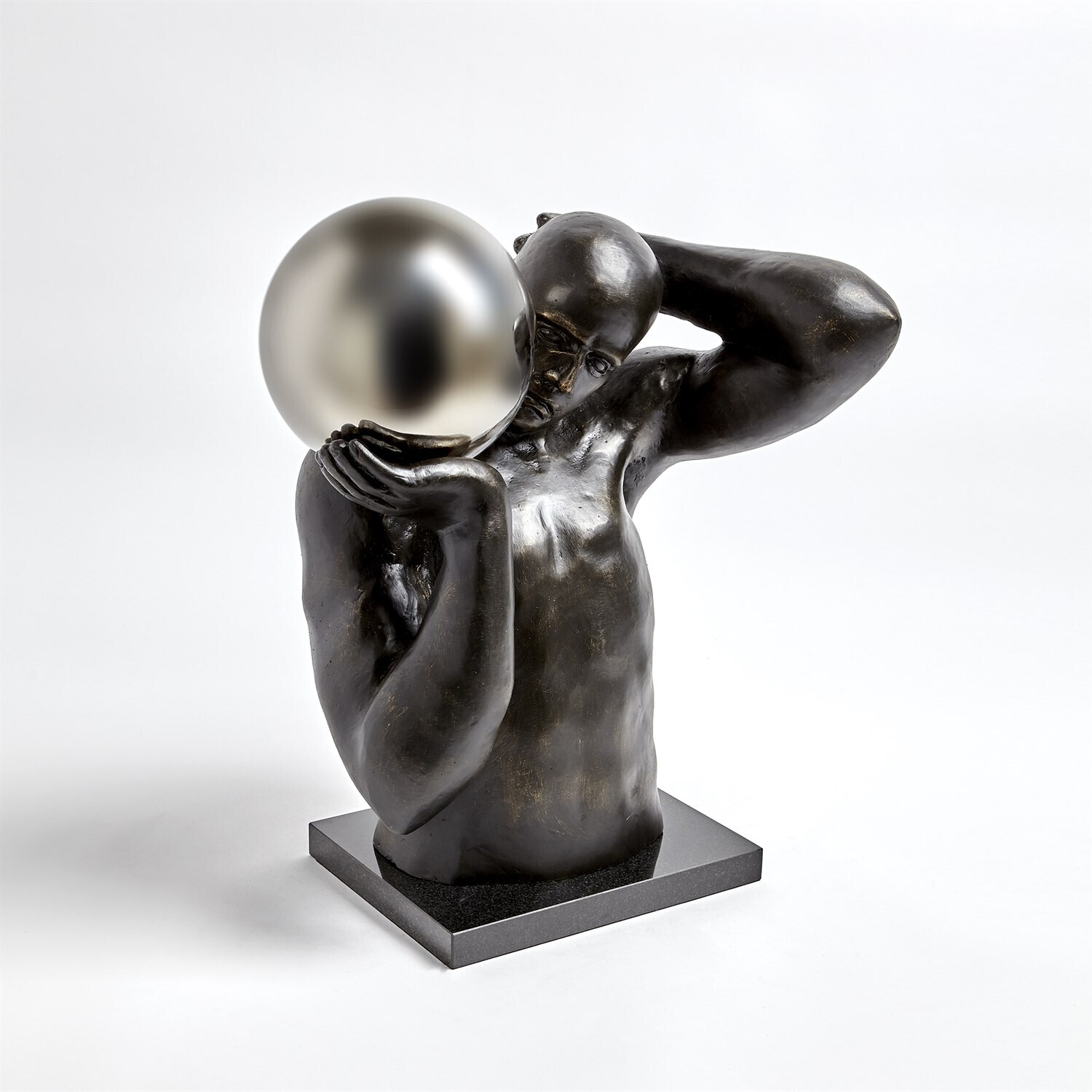 Shot Put Sculpture - Cast Iron on Black Granite