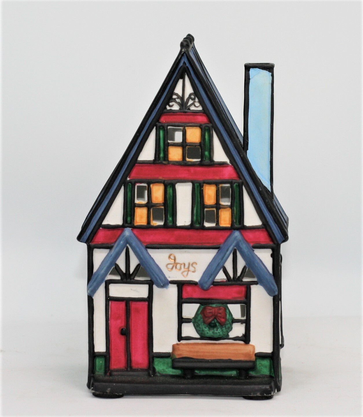 Experience Festive Bliss with Tealight Candle in Christmas Cottage