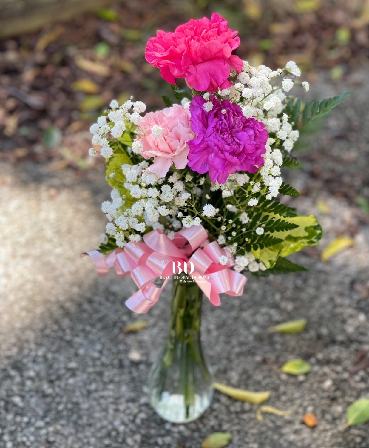 3 mixed carnations in a vase