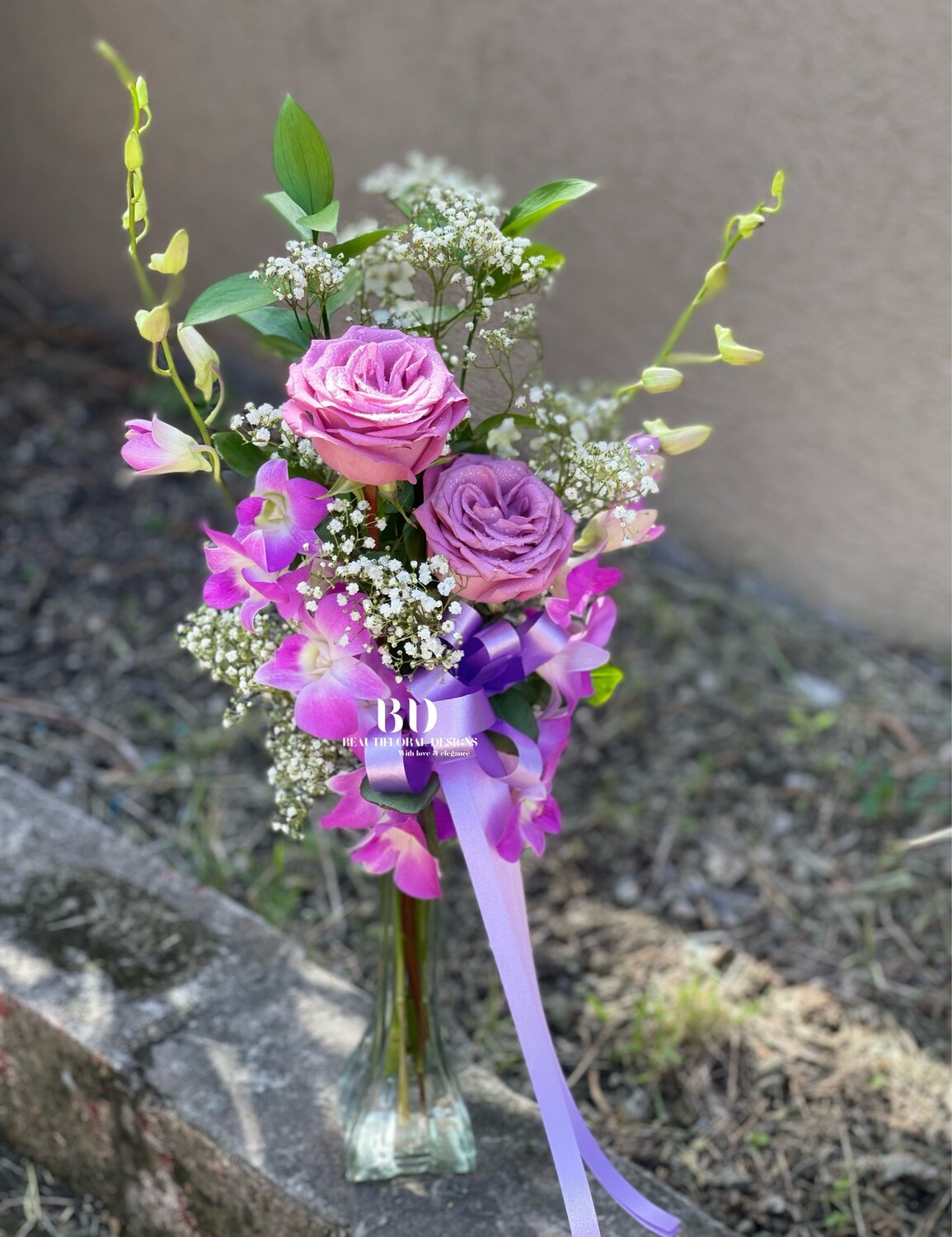 2 orchids, 2 roses in a vase