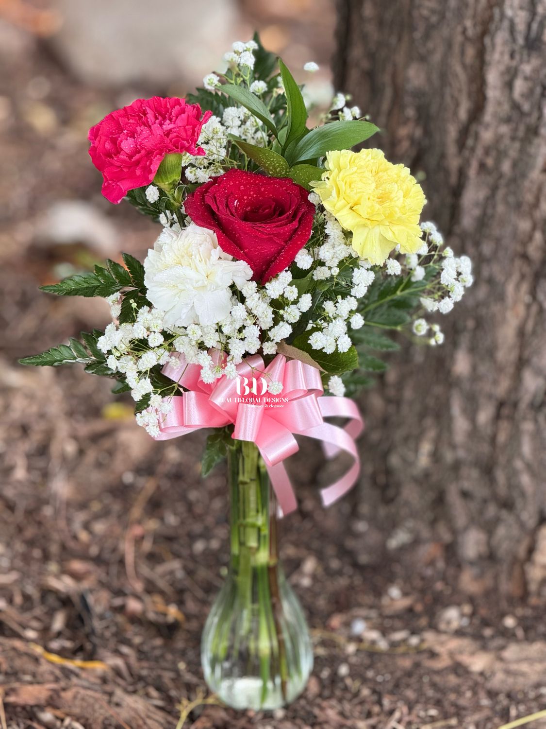 3 carnations 1 rose in a vase