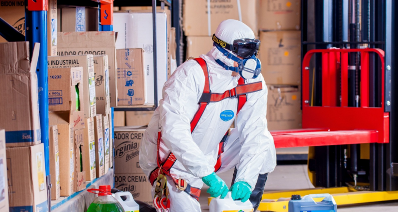 Trainee in full PPE and safety harness during industrial painting and surface preparation training