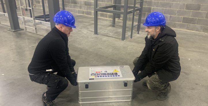 Industrial training session with workers preparing safety equipment in Belfast