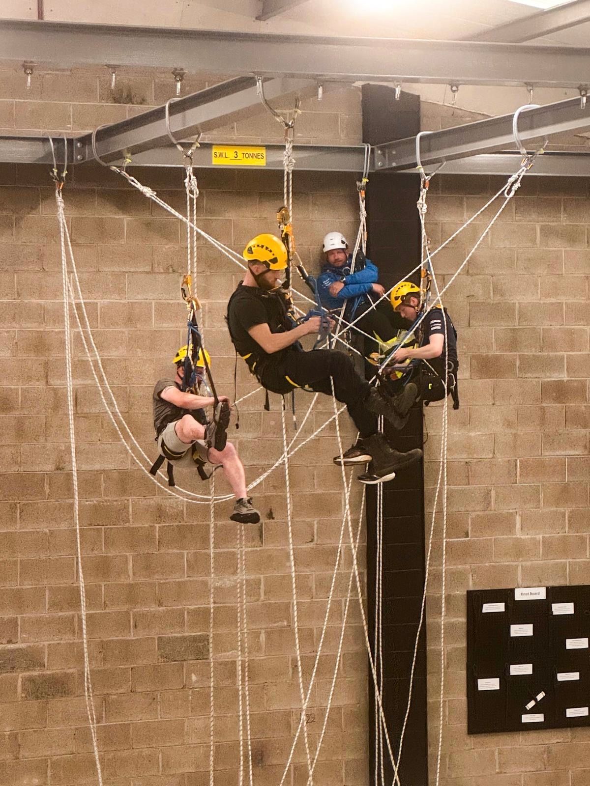 IRATA Level 2 rope access candidates practising advanced manoeuvres at Dangle Academy in Belfast