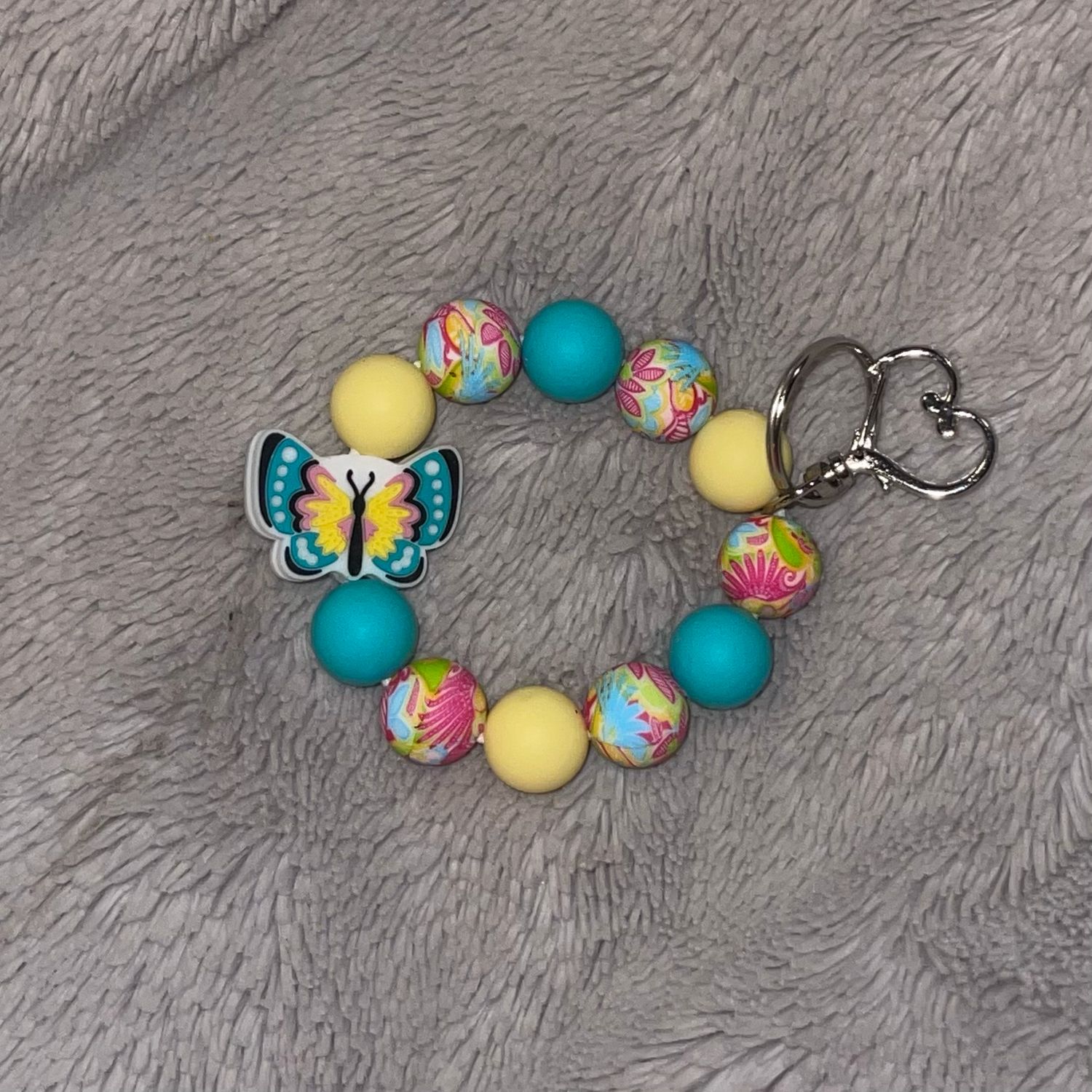 Butterfly Bracelet With Teal Yellow And Flowered Silicone Beads