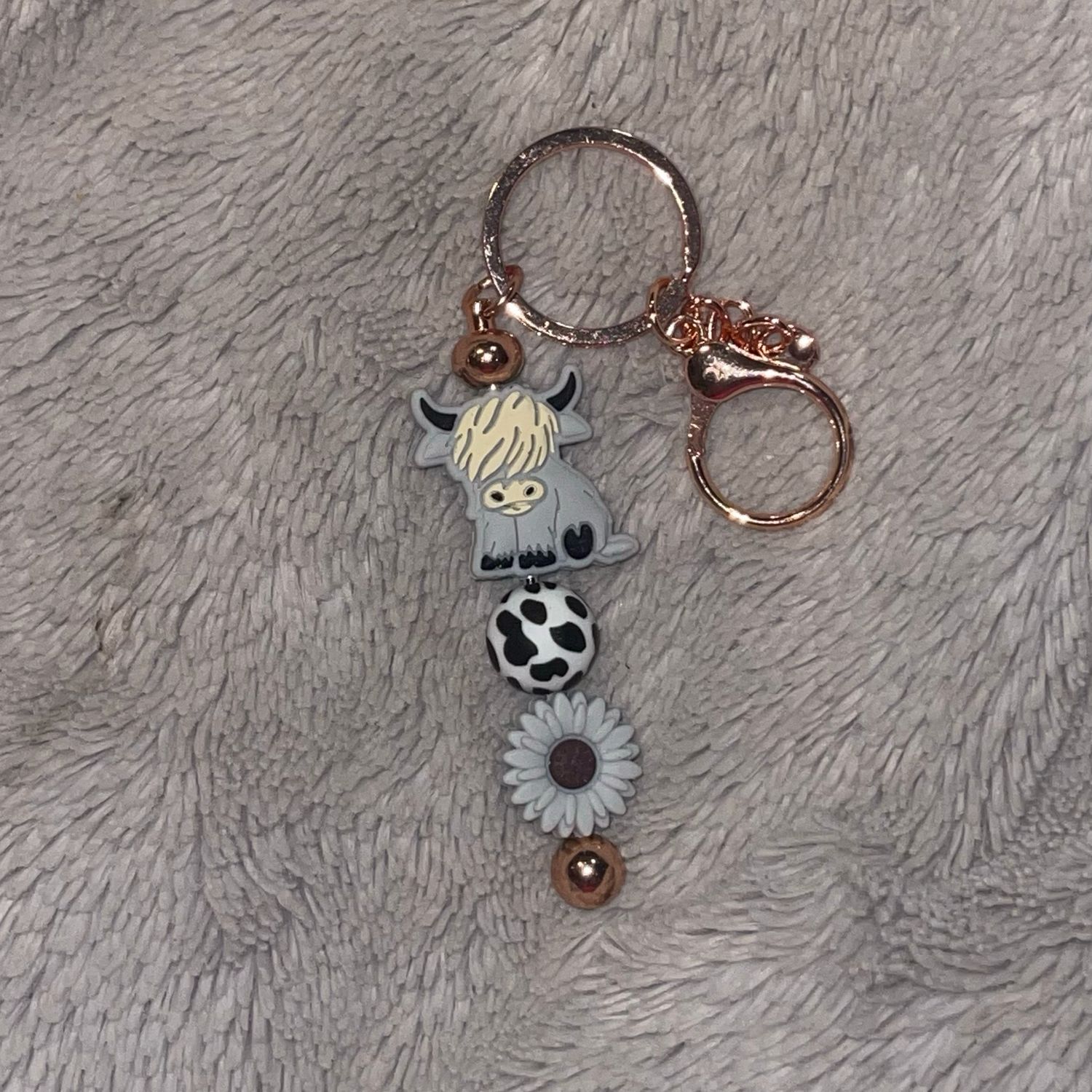 Grey Highland Cow With Cow Spotted, And Gray Flower Silicone Bead On Beaded Bar Keychain