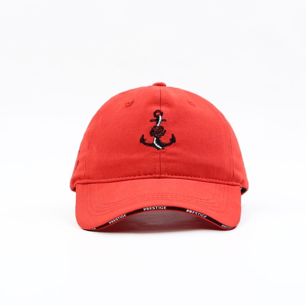 Red baseball cap with red and black anchor/rose front panel embroidery