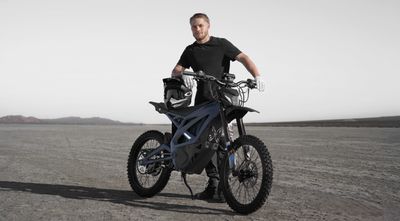 Man in desert with e-moto bike
