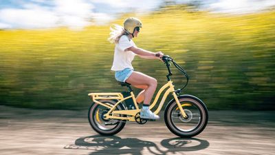 Girl riding Murf electric bike on scenic trail in San Clemente, CA