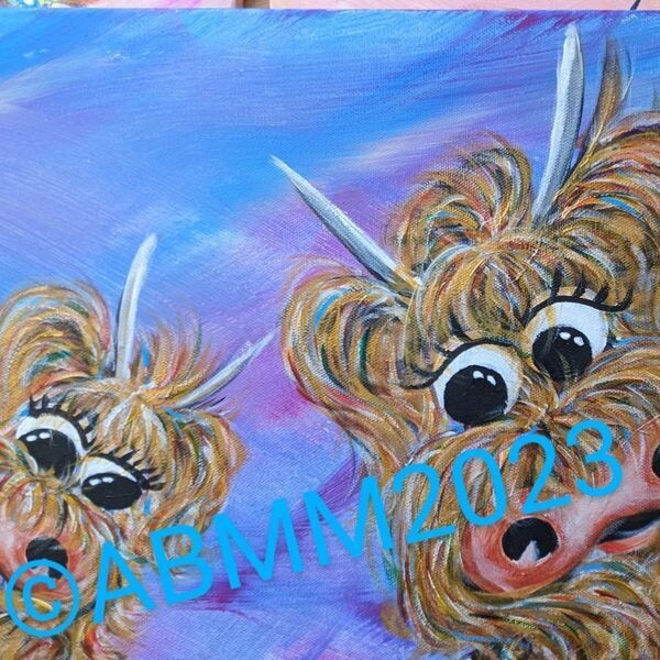 A pair of rainbow inspired character highland cows on a blue background.